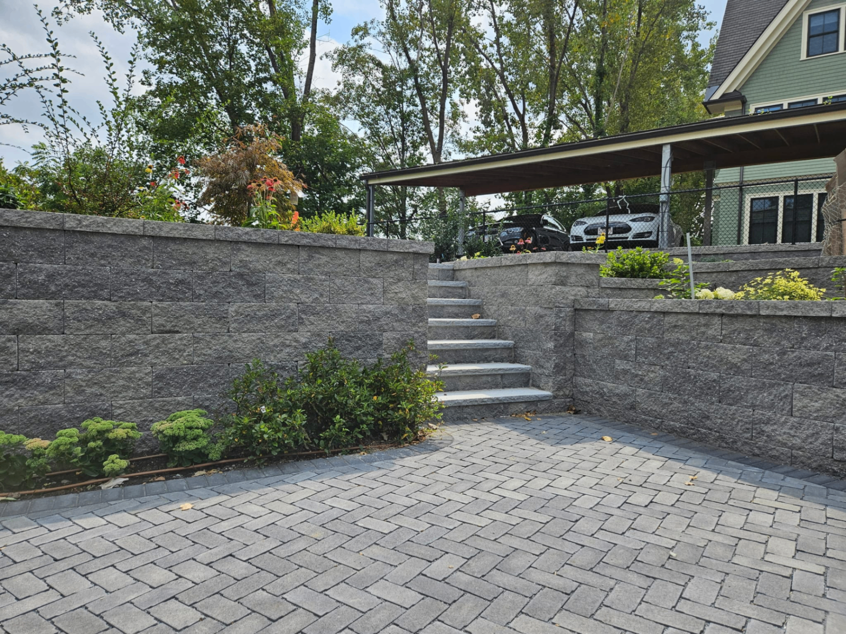 Finished paver patio and retaining wall in Greater Boston